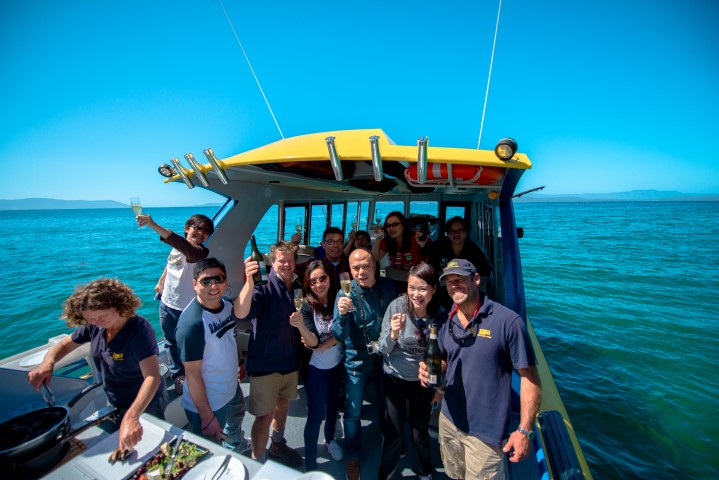 Group enjoying lunch aboard Tasmanian Seafood Seduction